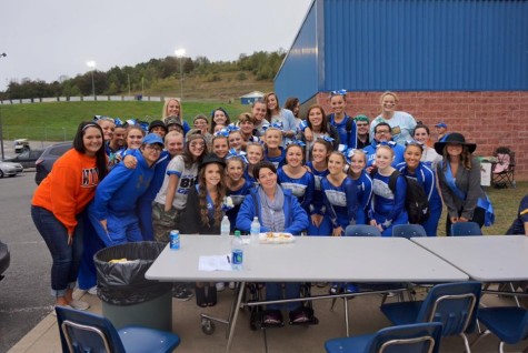 Several members of the LCHS Honor Society, cheerleading squad and War Zone surround beloved teacher, Mrs. Jena Whiston, at the Homecoming Tailgate Fund-raiser to assist with medical expenses incurred from Whiston's diagnosis of Lyme Disease.