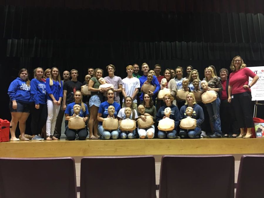 Healthcare Fundamental students pose with their new set of CPR practice models.
