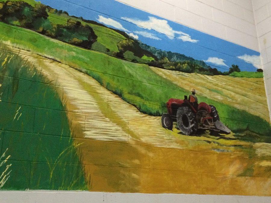 A mural painted in the stairwell by the 2015-2016 National Art Honor Society members.