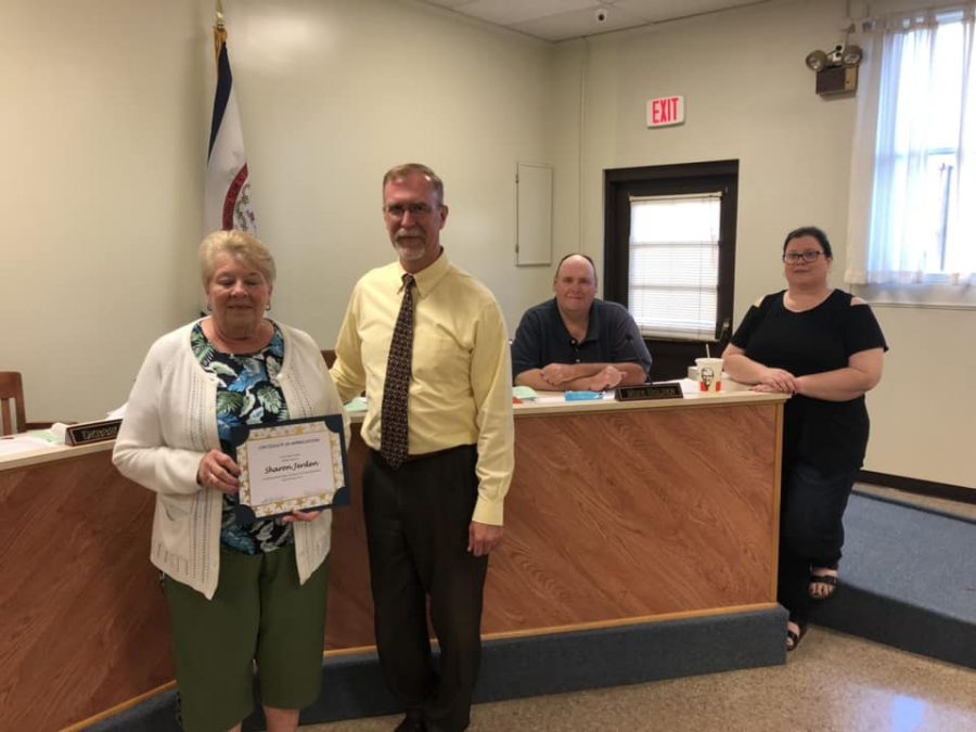 Mrs. Sharon Jerden is presented a certificate of appreciation by Principal John Whiston in the Oct. 8 LCBOE meeting.